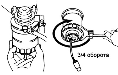 в) Заверните топливный фильтр до касания кронштейна и доверните ключом на три четверти оборота.