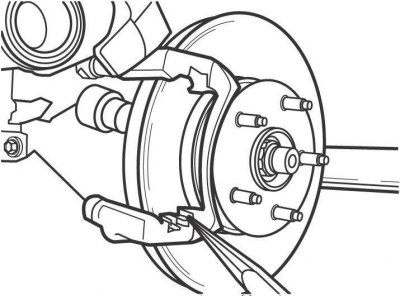 Рис. 11.16. Снятие направляющей тормозной колодки