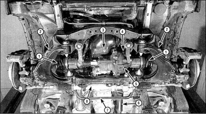 1. Передняя ведущая полуось; 2. Пружина; 3. Сливная пробка масляного поддона; 4. Пробка…