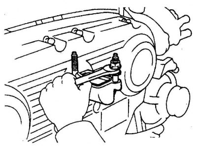 8. На двигателях 3,0 л выверните шпильки из патрубка охлаждающей жидкости.