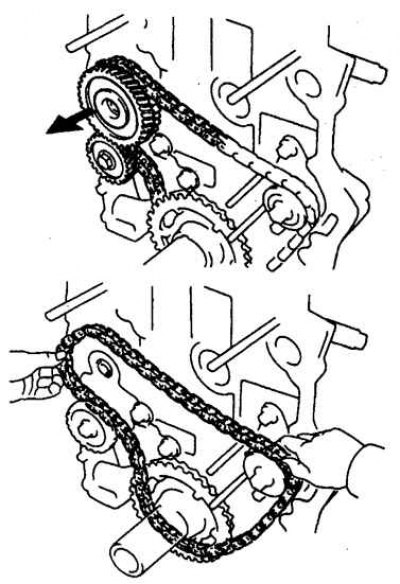 6. Отверните болт и снимите ведущую шестерню верхнего вала и цепь.